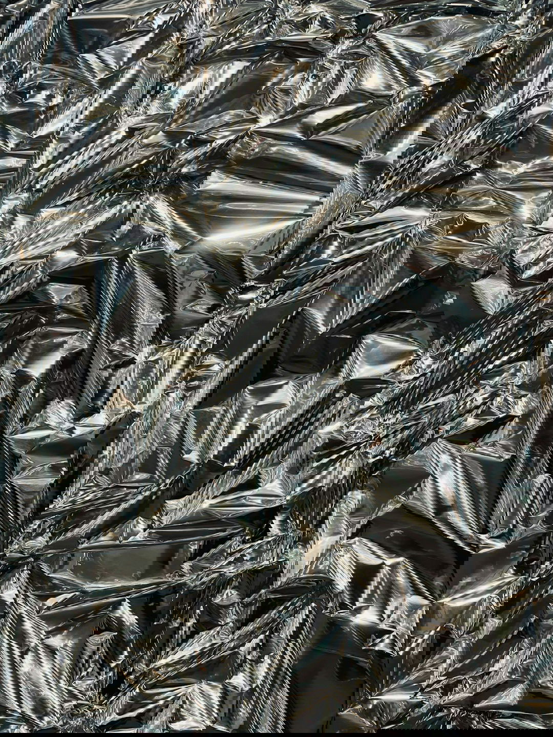 a large pile of shiny silver foil